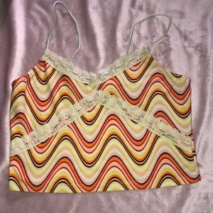 A wave print tank top with lace designs
